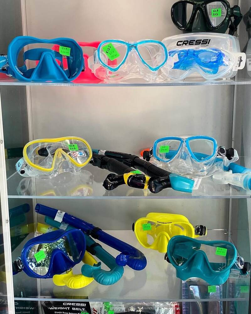 Shelves of rental masks and snorkels at Dive Bequia
