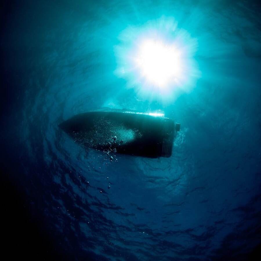 View from underwater looking up at a boat hull and sunlight near Bequia — a snorkeler's perspective